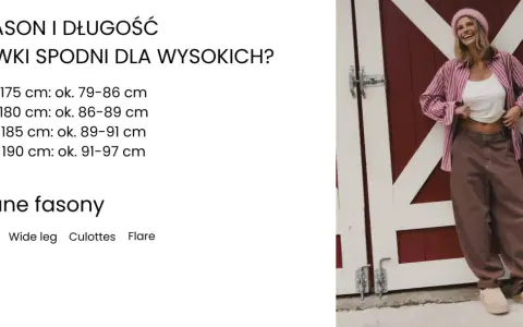 Uśmiechnięta kobieta w różowej czapce i koszuli w paski, stojąca przed czerwoną stodołą.